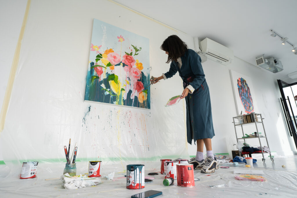 Stackt Market Toronto | Artist painting at a Stackt Market pop up | Homes Almanac