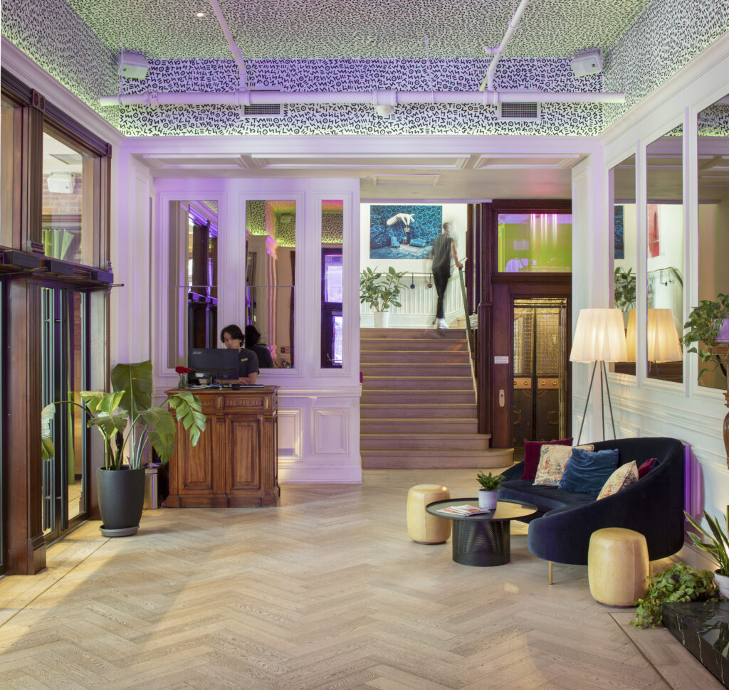Gladstone House Toronto | Lobby with softened lighting and cushy seating | Homes Almanac