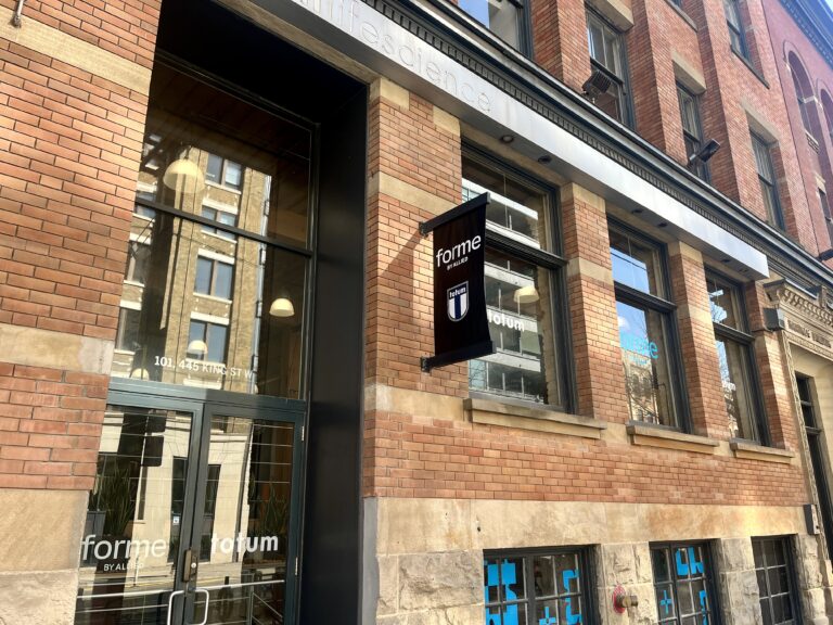 Totum Life Science Toronto | Exterior view with red brick in the afternoon sun | Homes Almanac