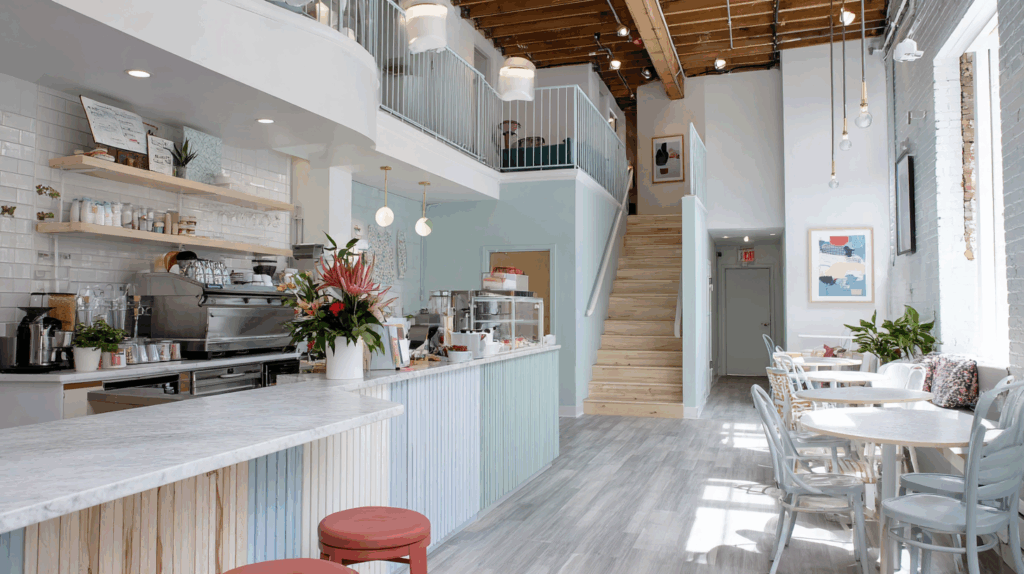 Third Places | Calm, minimal and inviting coffee shop interior with seating and barista bar | Homes Almanac