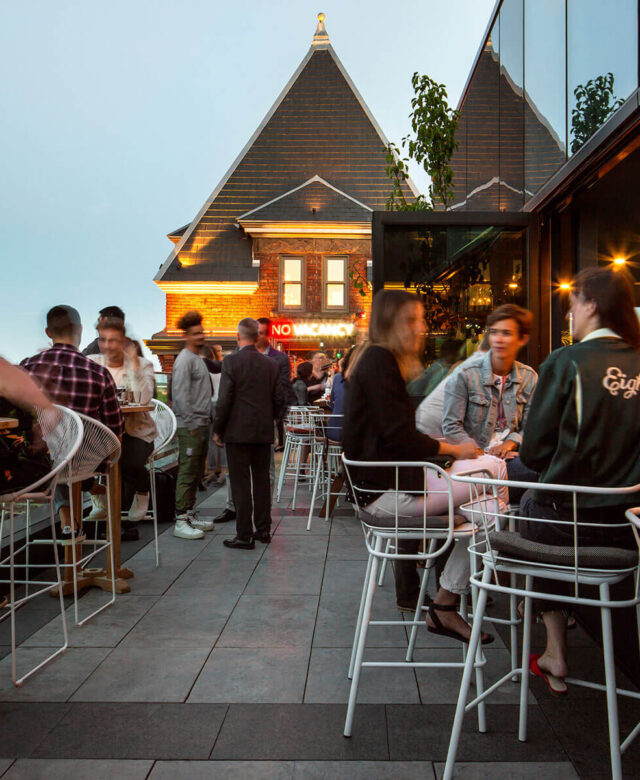 The Rooftop at the Broadview Hotel | Evening at the rooftop with people mingling | Homes Almanac