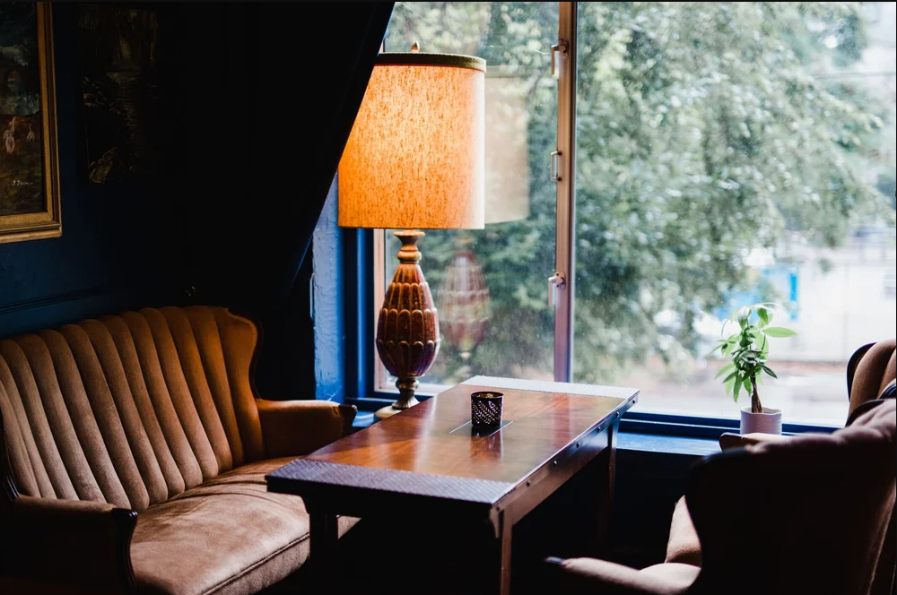 The Red Accordion Vancouver | Cozy dining seating by a window | Homes Almanac