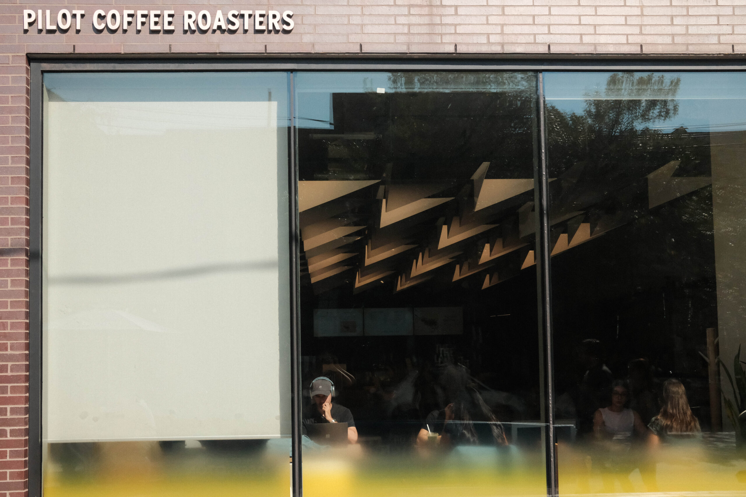 Pilot Coffee Roasters on Ossington | Floor to ceiling windows of coffee shop | Homes Almanac