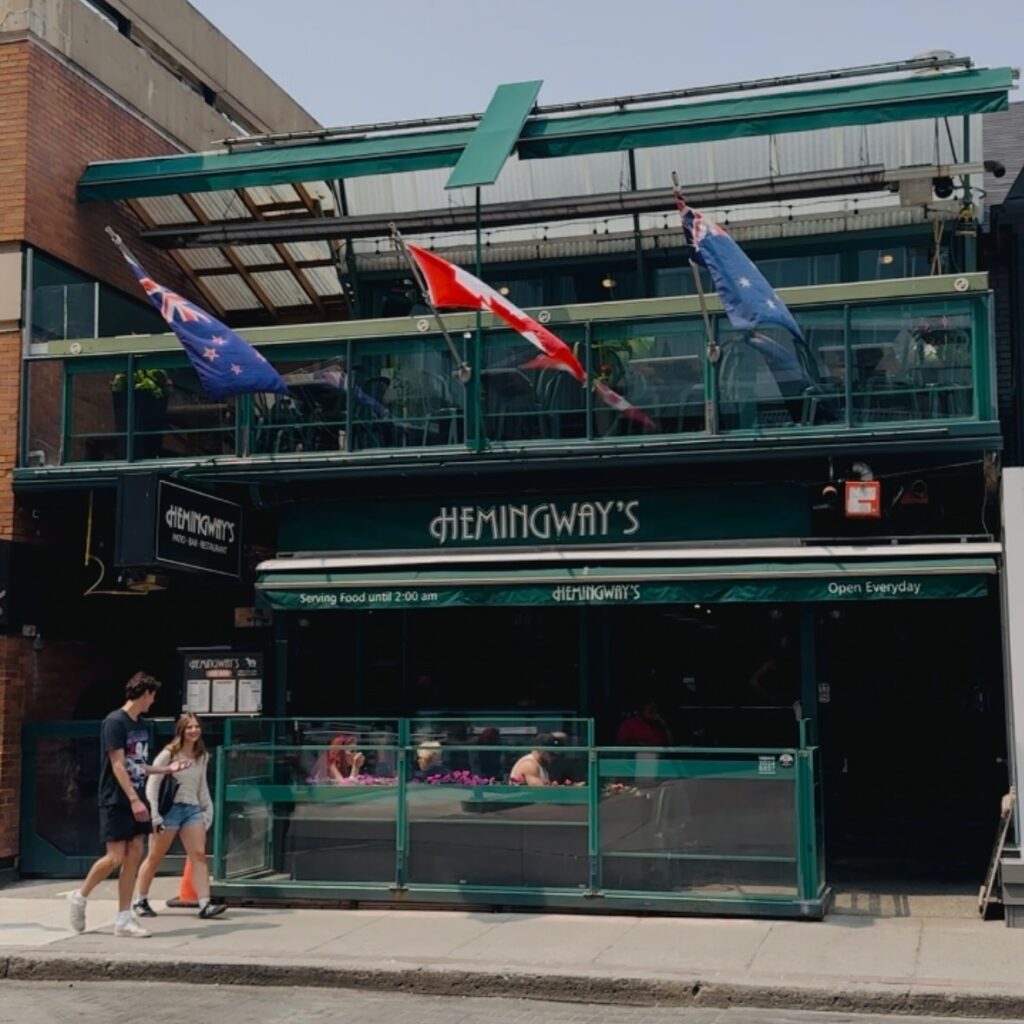 Hemingway's Restaurant and Bar | Exterior of restaurant with green sign | Homes Almanac