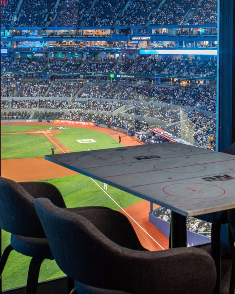 Sportsnet Bar | View of Rogers Arena with grey table and chairs | Homes Almanac
