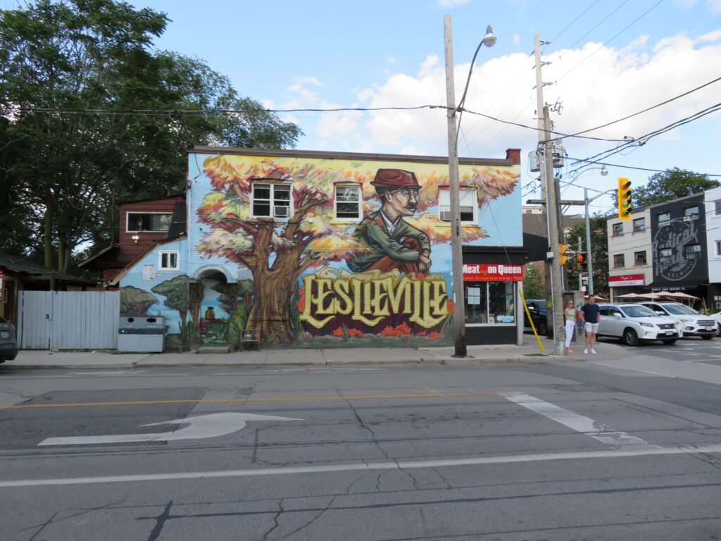 Iconic Leslieville Mural on Queen and Jones by ELICSER on a sunny day | Queen Street Toronto Street Art | Homes Almanac