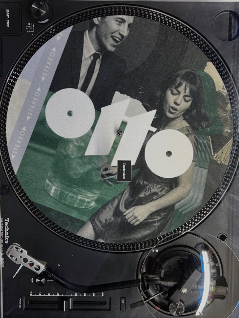 A vinyl record with Osteria Otto's logo on it | Osteria Otto Mount Pleasant | Homes Almanac