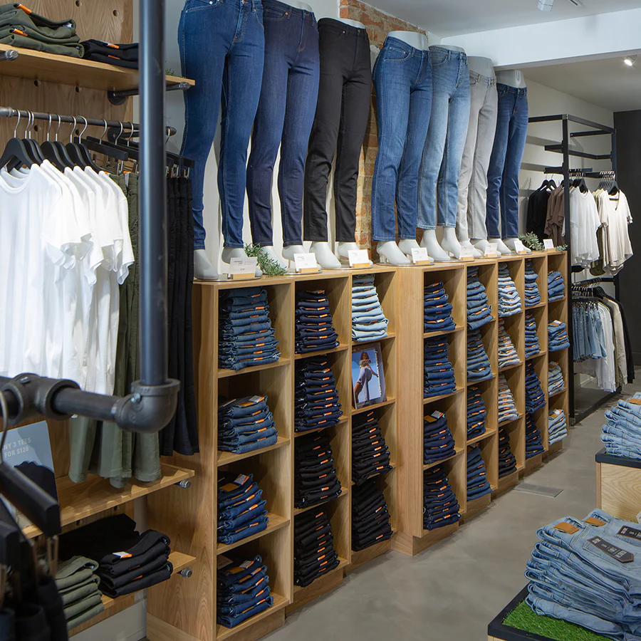 Duer | Neatly folded shelves full of denim and mannequins wearing denim | Homes Almanac