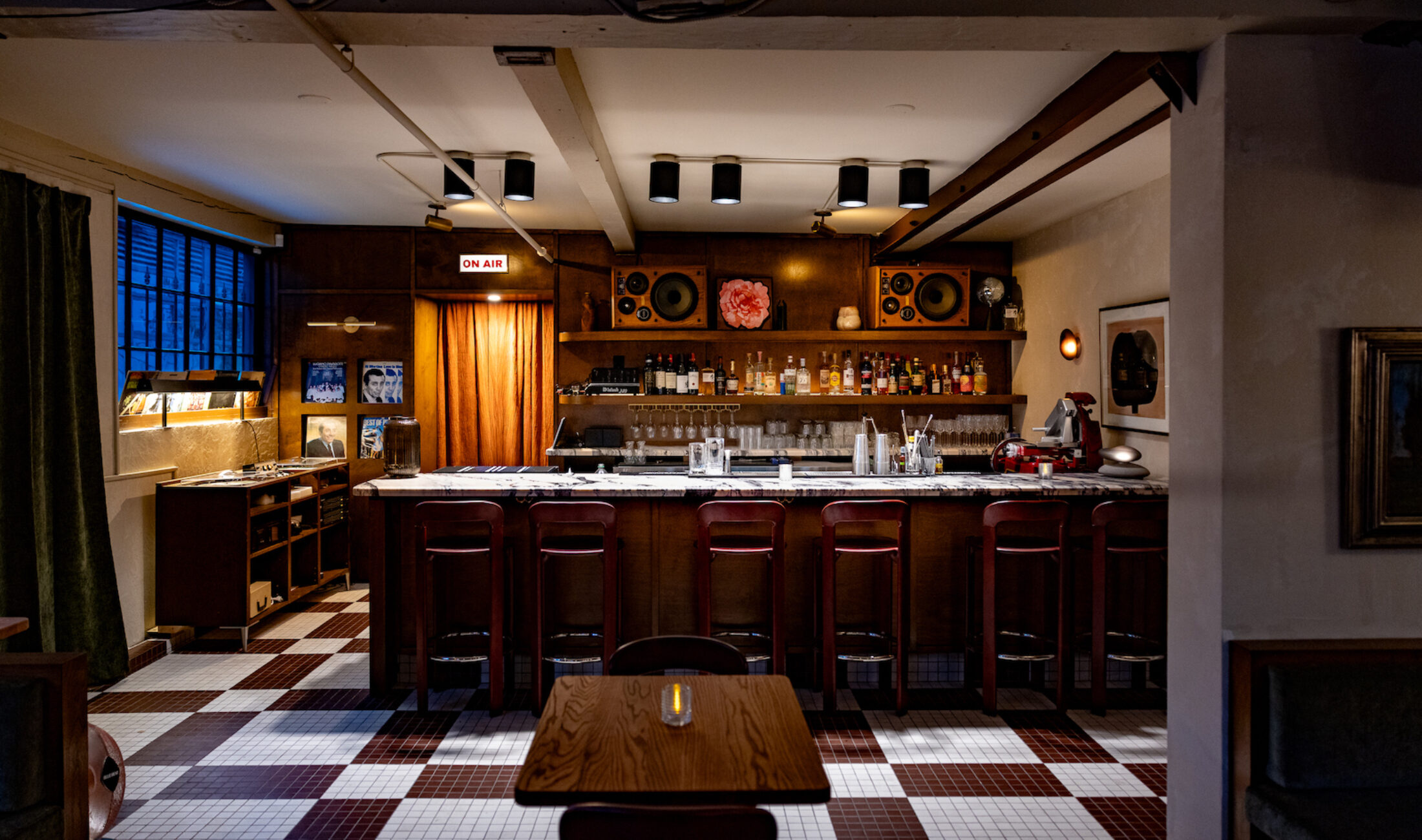 The wooden bar with moody lighting at Osteria Otto | Osteria Otto Mount Pleasant | Homes Almanac