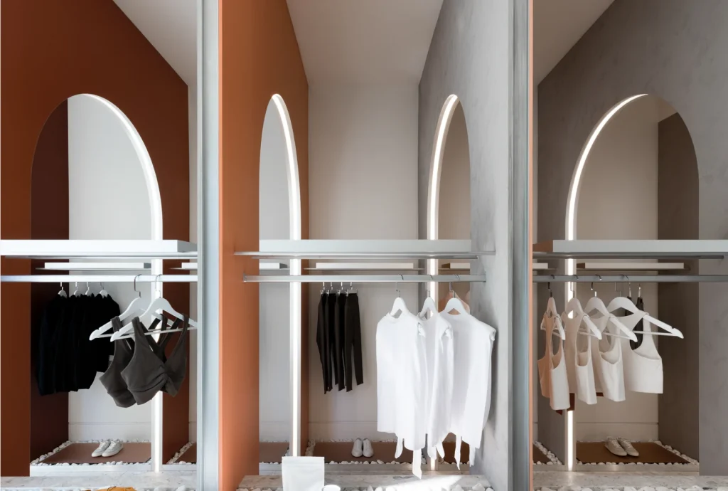 Permission | Minimal aesthetic clothes hanging on rack and high archways | Homes Almanac